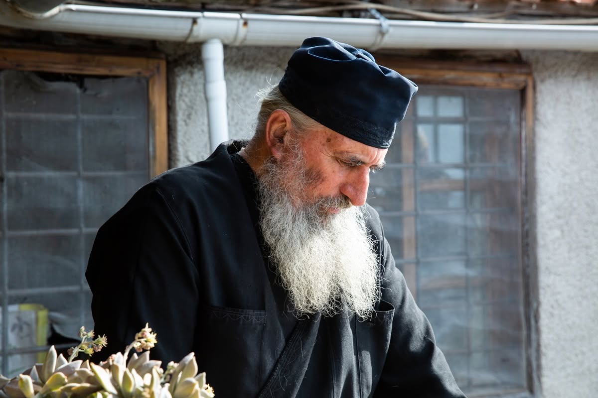 A monk tending plants